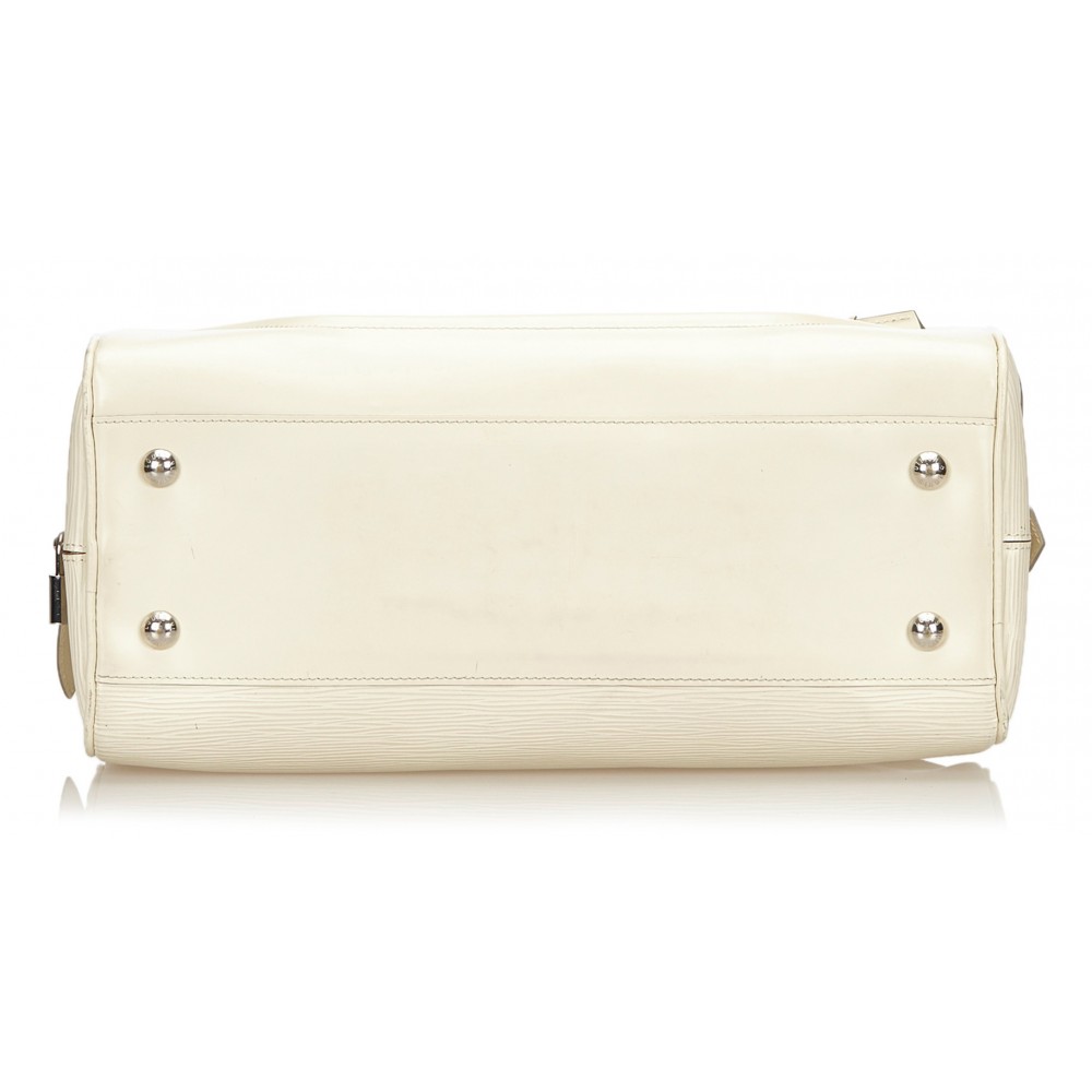 A Louis Vuitton White Epi Leather Bagatelle PM Bag. - Bukowskis