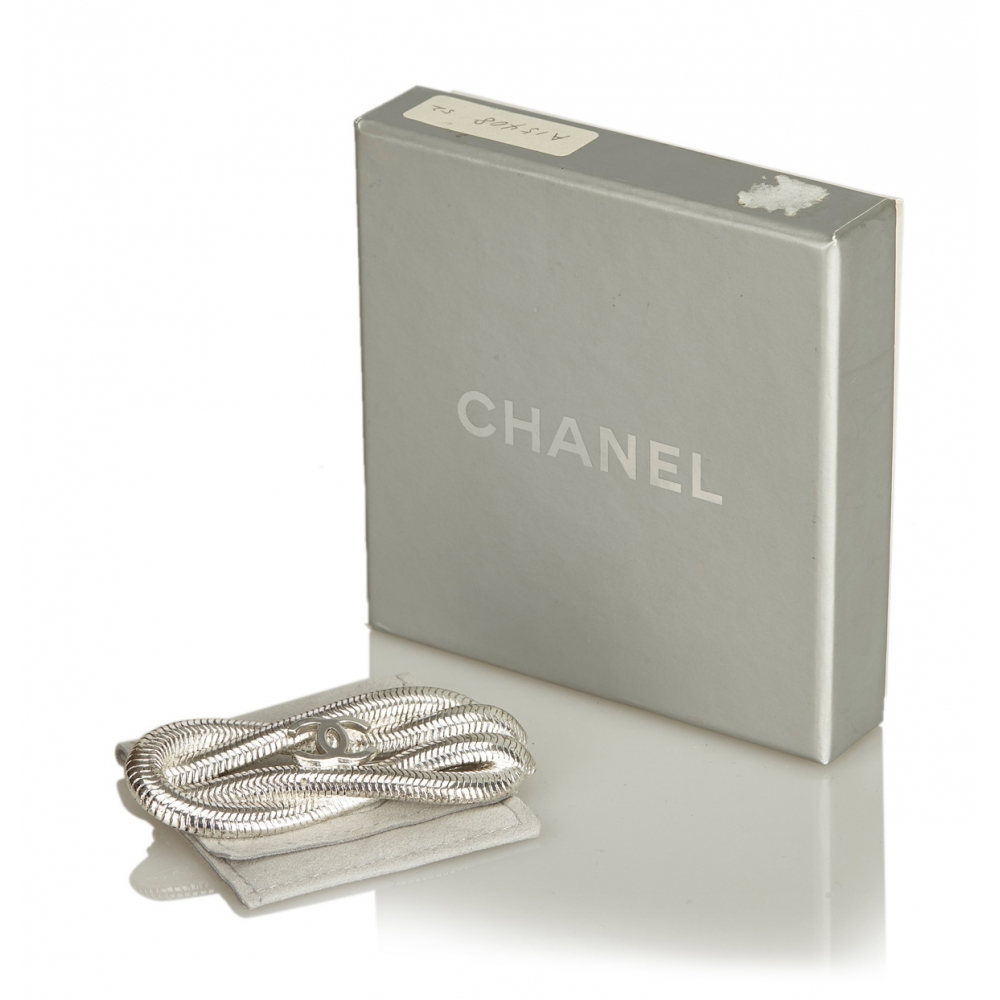 Louis Vuitton spilla Multi Charmes in metallo argento e oro. - La Belle  Epoque
