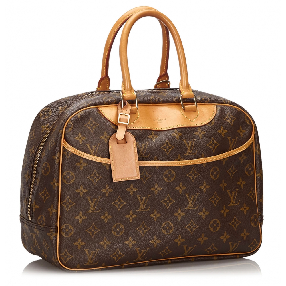 Sold at Auction: Louis Vuitton Brown Monogram Coated Canvas Deauville  Shoulder Bag, the exterior with an open side pocket and vachetta leather  handle