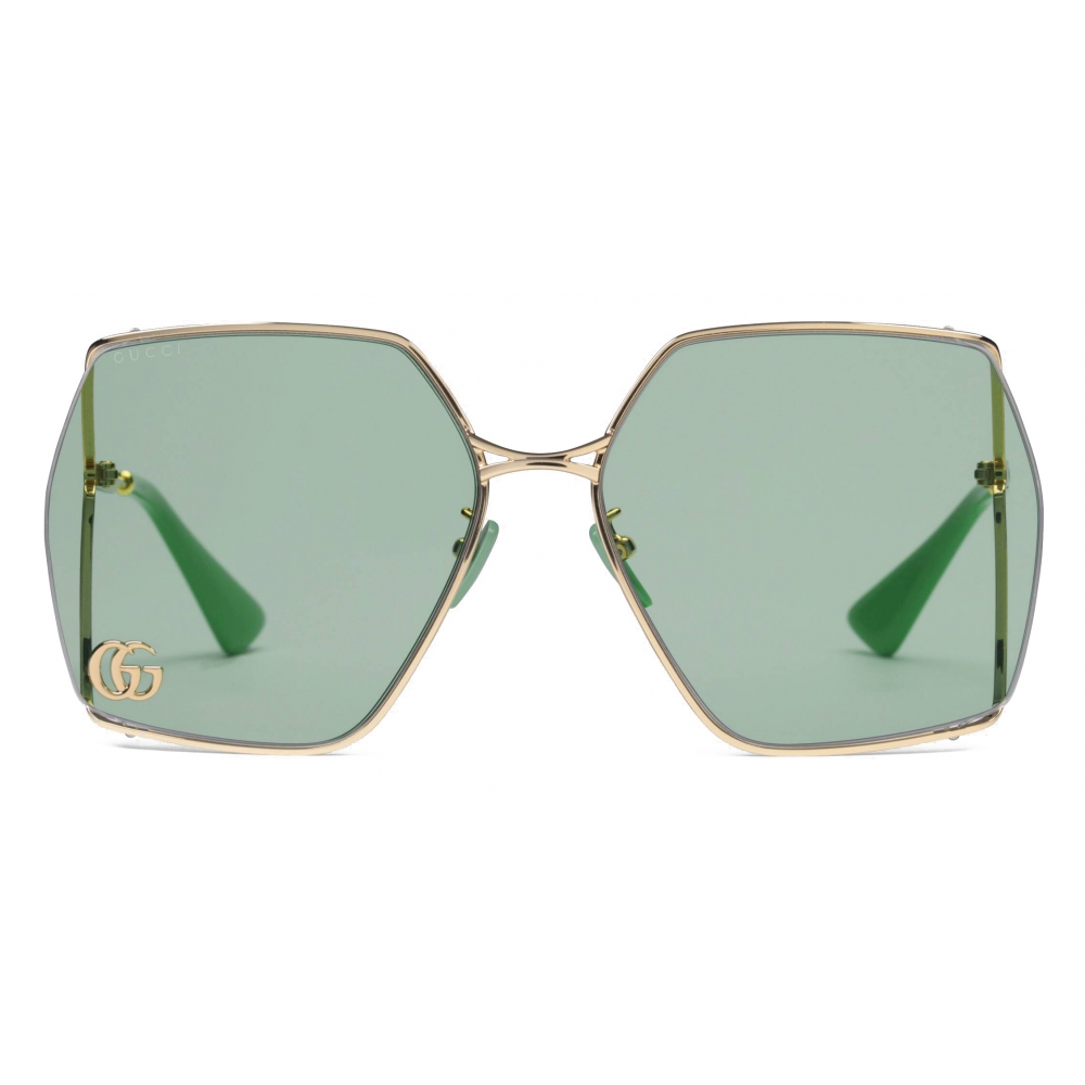 Gucci OvalFrame Sunglasses Gold Light Blue Gucci Eyewear Avvenice